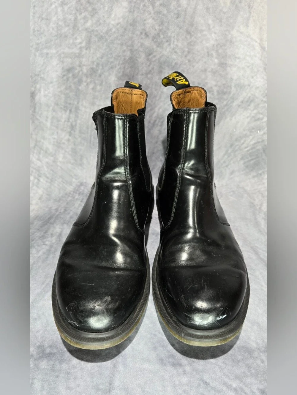 These boots are the iconic Dr. Martens 2976 Chelsea Boots